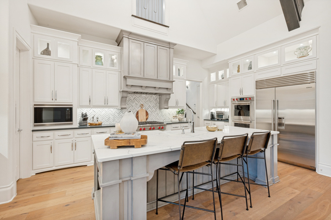 Kitchen with a large island, commercial-grade gas range and double ovens